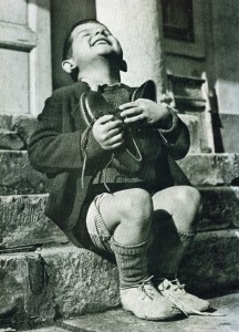 An Austrian boy couldn’t be more excited about his first pair of new shoes in years, 1946