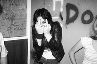 Joan Jett Flips Me The Finger 1977: Joan Jett is not pissed off at me.  She is just being Joan!  We were all hanging around backstage waiting for Joan and the rest of The Runaways to take the stage.  In a thousand years when a historian finds this photo they will be able to pinpoint the exact location by looking at the hieroglyphics on the wall of The Whiskey.