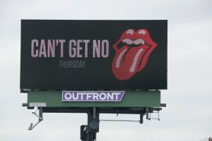 A digital billboard at the intersection of Dierker and Henderson Roads in Columbus appears to be heralding the announcement of a concert tour coming this Thursday. (Dispatch Photo by Barbara J. Perenic)