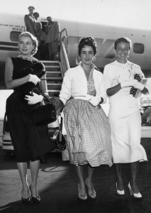 Grace Kelly, Elizabeth Taylor, and Laraine Day arriving at the New York International Airport, 1954