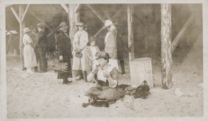Woman drinking a soda on the beach, ca. 1920s