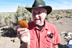 Brian Jennings holds a multi-tool thought to be roughly 15,800 years old.