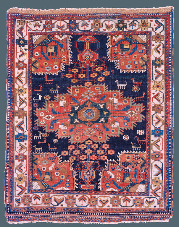 Afshar, Southwest Persia, Late 19th C., 4'0" X 5’6" Afshar, Southwest Persia, Late 19th C., 4'0" X 5’6" Afshar, Persia. Mid 19th c. 3' 5" x 4' 4" Afshar, Persia. Mid 19th c. 3' 5" x 4' 4" Published: “Oriental Rugs from Pacific Collections”, Murray L. Eiland, 1990. Page 79, plate #46. During the 19th century, the central medallion format, complete with complimentary corner pieces, was generally a design of large, formal workshop carpets. The nomadic weaver of this Afshar rug was inspired by the classic layout, but transformed it with her native, vibrantly colorful aesthetic. She dispensed with the classical formality, and instead focused on the purity of naturally derived color and added charmingly drawn animals to roam the indigo field. This rug exemplifies the true spirit of Afshar weaving.